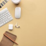 Keyboard and Mouse on Beige Background