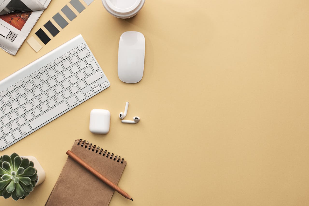 Keyboard and Mouse on Beige Background